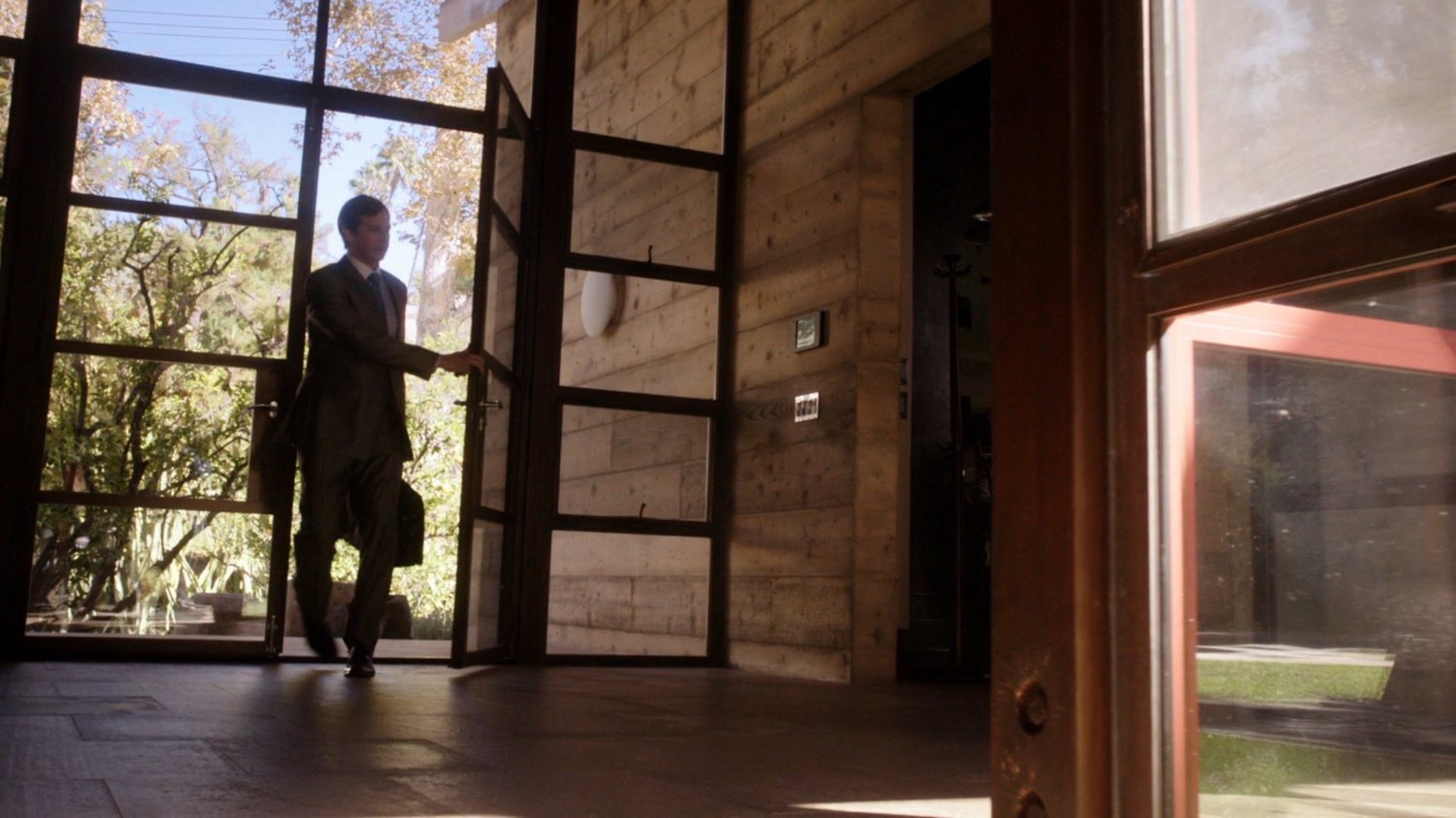 Lloyd Rathman enters his house.