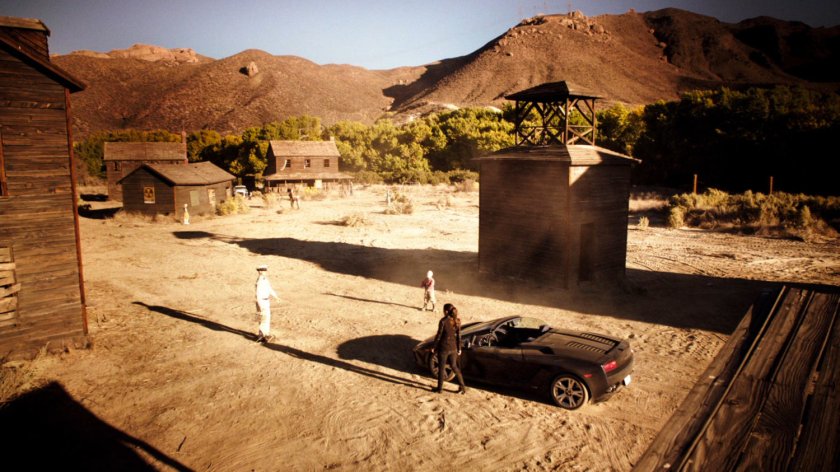 Skye outside an abandoned atomic ghost town.