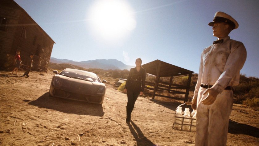 Skye outside an abandoned atomic ghost town.