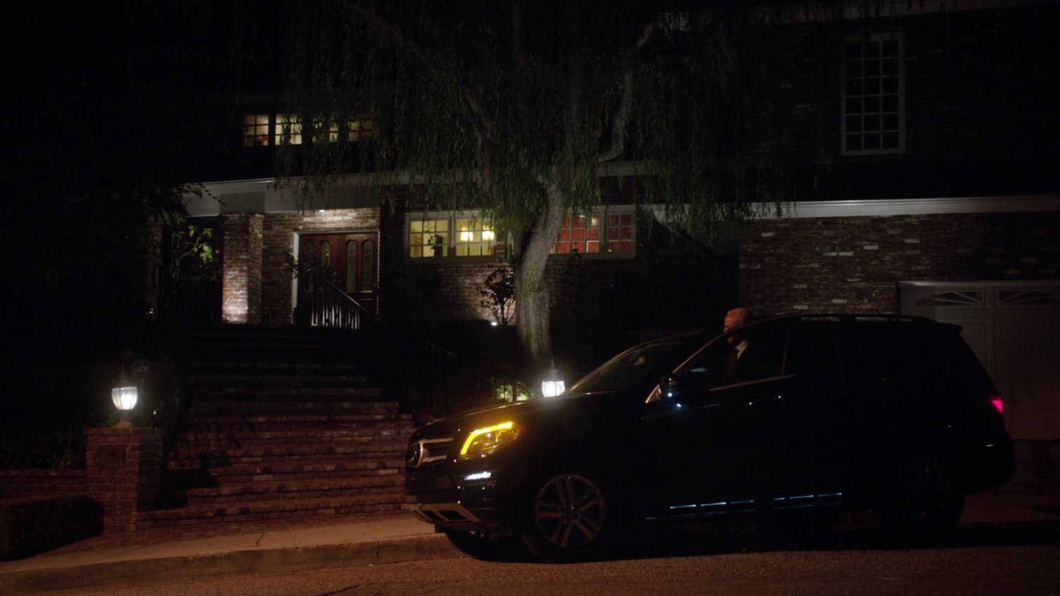 Nighttime exterior of Dr. Streiten's house.