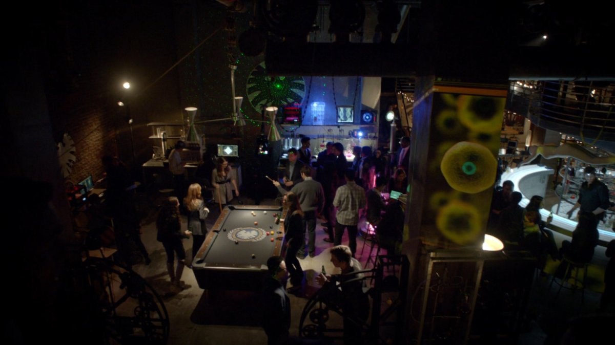 View of patrons in SHIELD club and bar from second floor walkway.