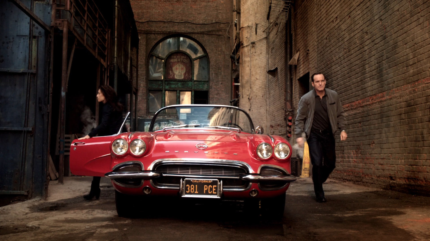 May and Coulson exit Lola in a Mexico City alley.