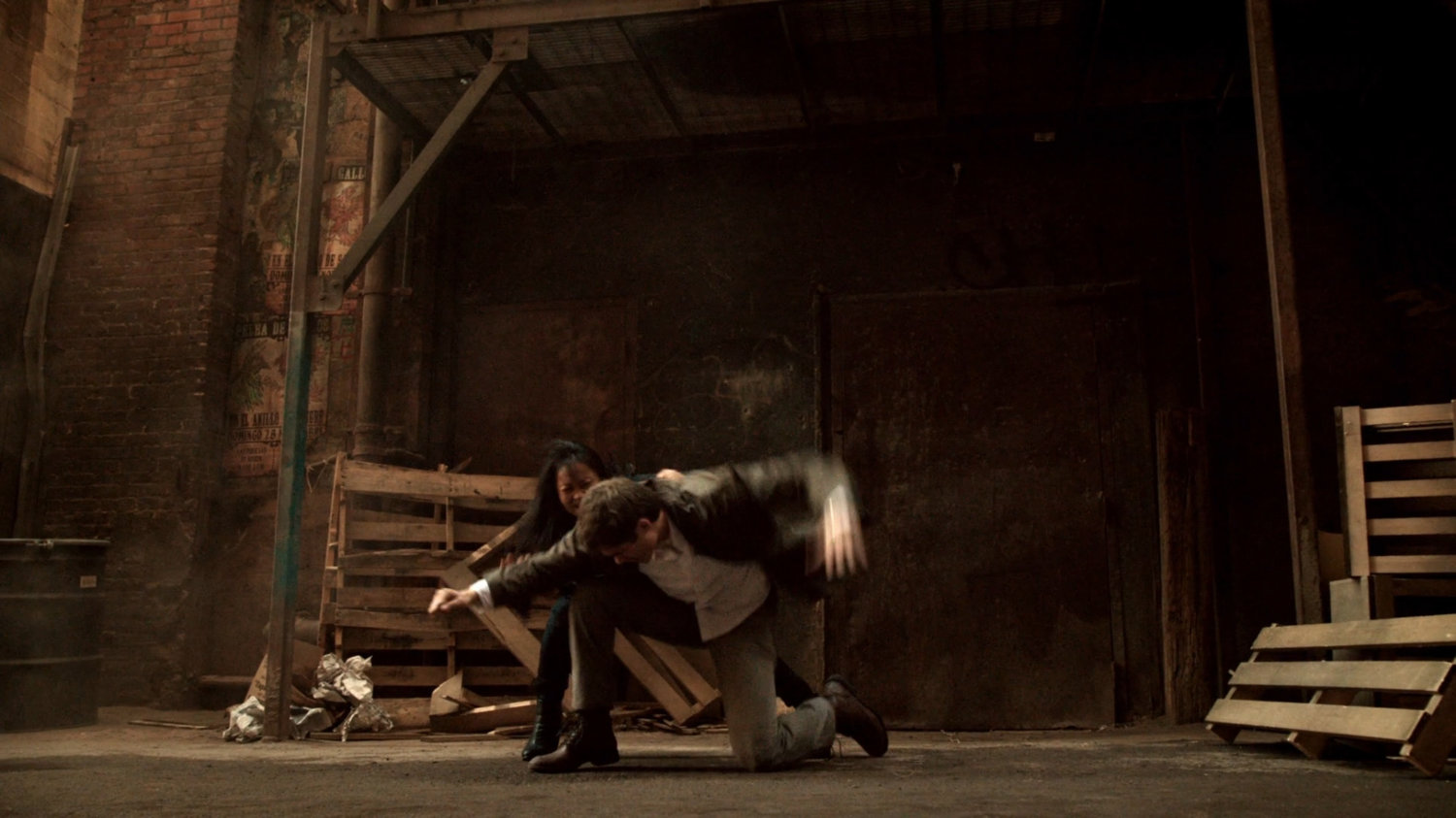 Agent May fights Agent Lumley in a Mexico City alley.