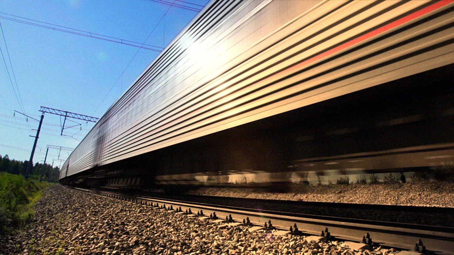 Train speeding past camera.