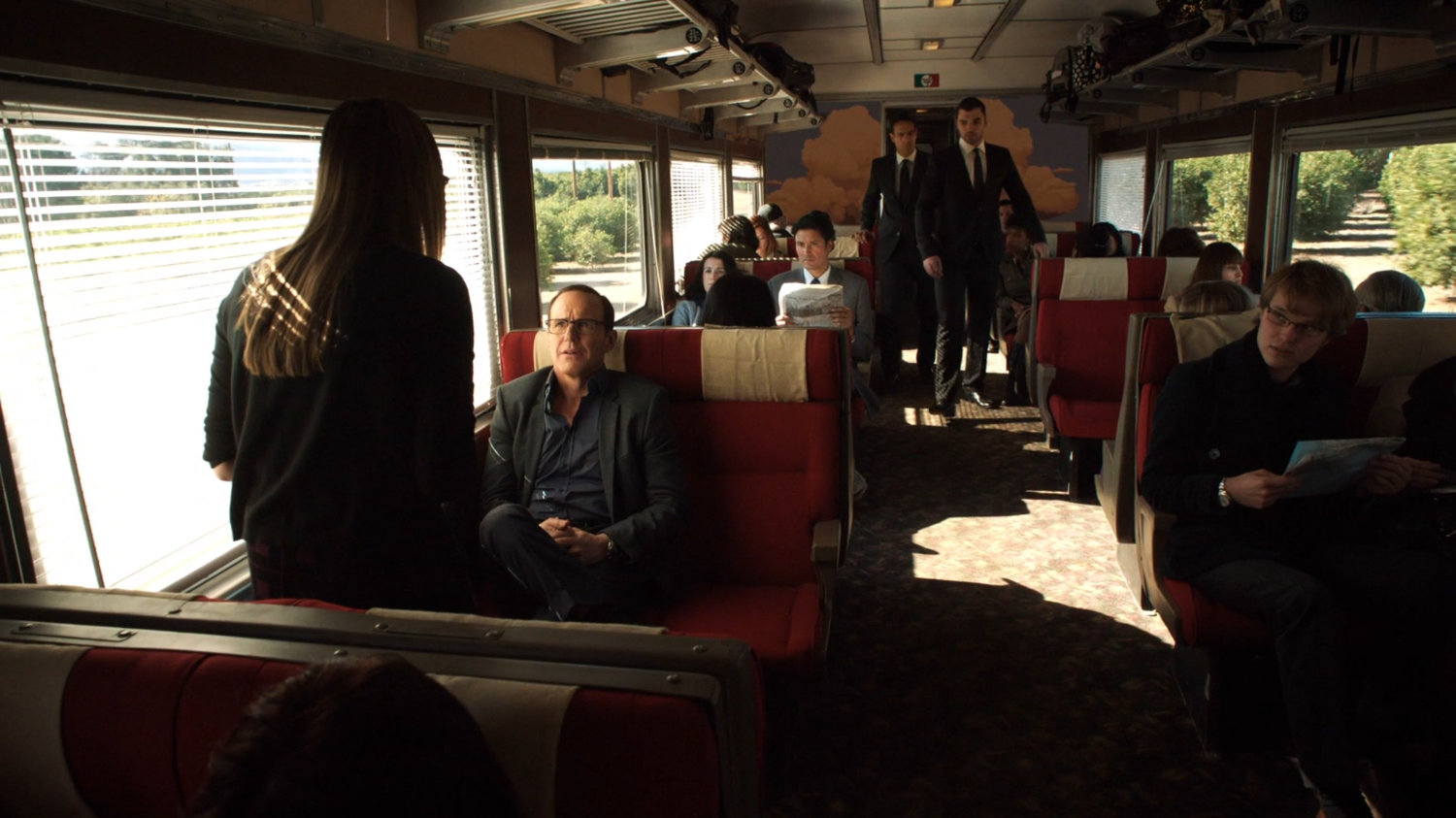 Simmons and Coulson on an Italian train.