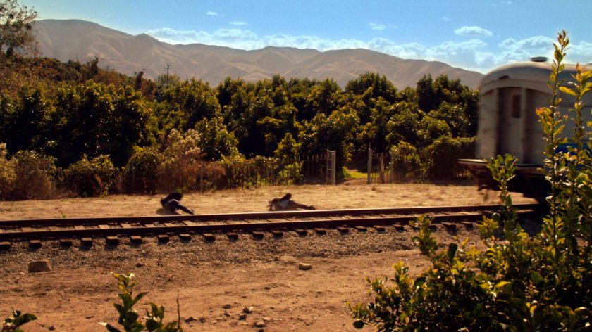 Ward and Coulson jumping off back of train.