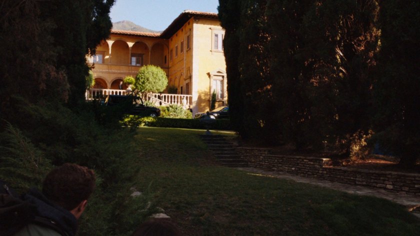 Long shot of exterior of Italian villa.