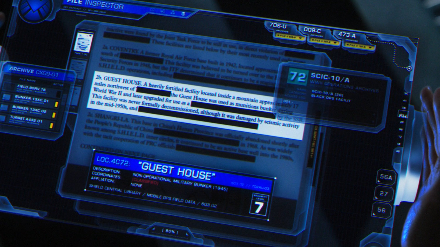 Closeup of tablet showing details on the Guest House facility.