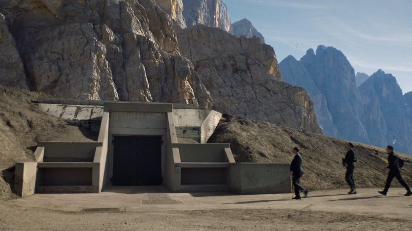 Agent Coulson and other agents walks towards the entrance to the Guest House.