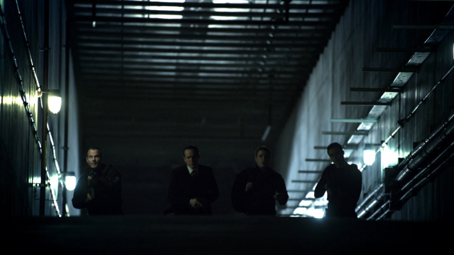 SHIELD agents in the tunnels of the Guest House.