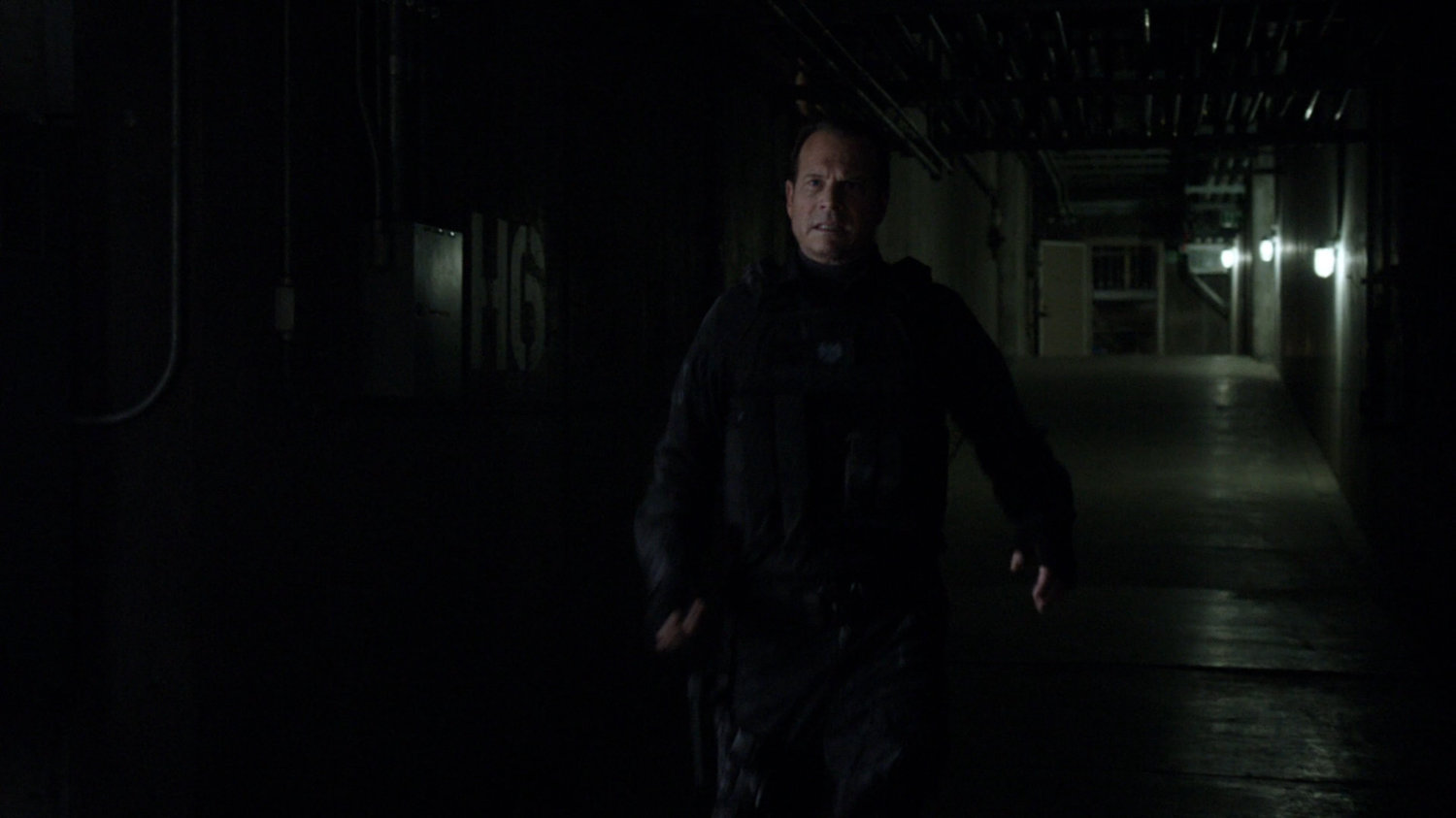 Agent Garrett in the tunnels of the Guest House.