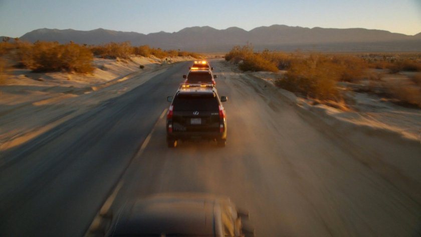 SHIELD SUVs race along Death Valley road.