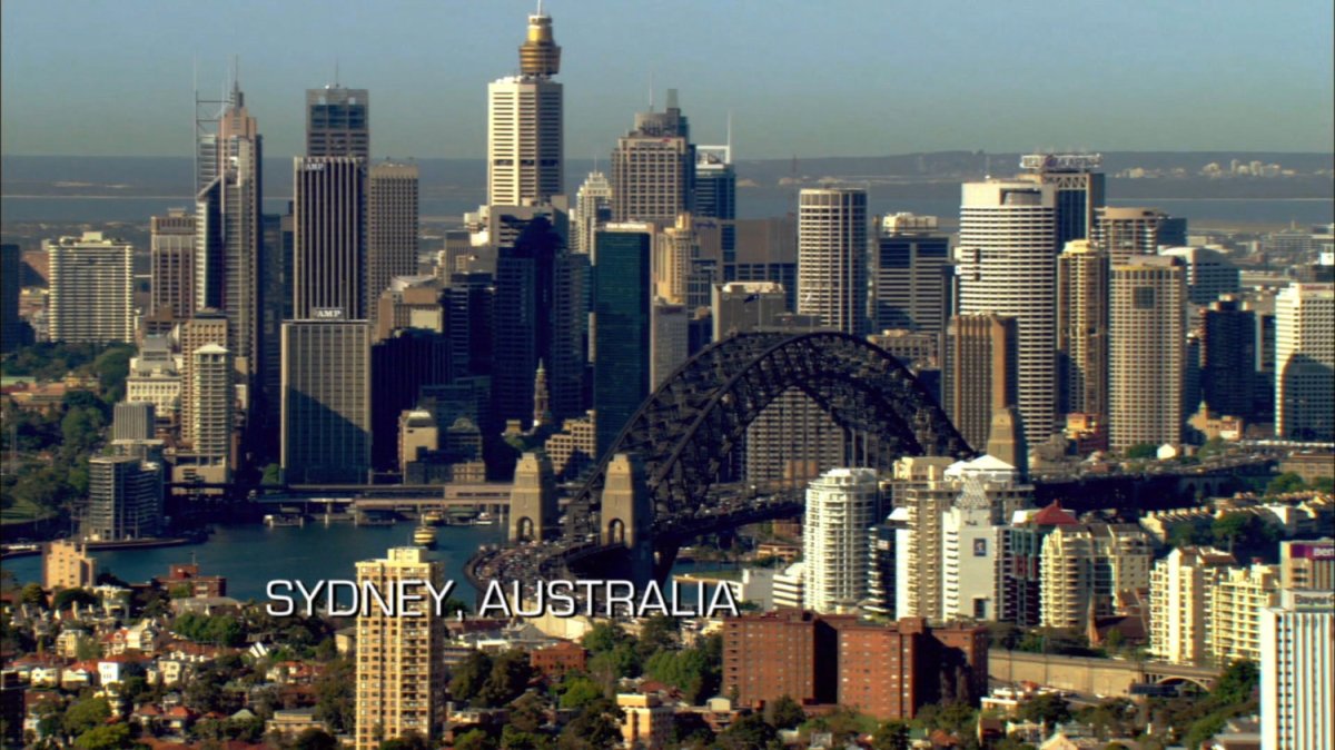 Aerial view of downtown Sydney. Text: Sydney, Australia.