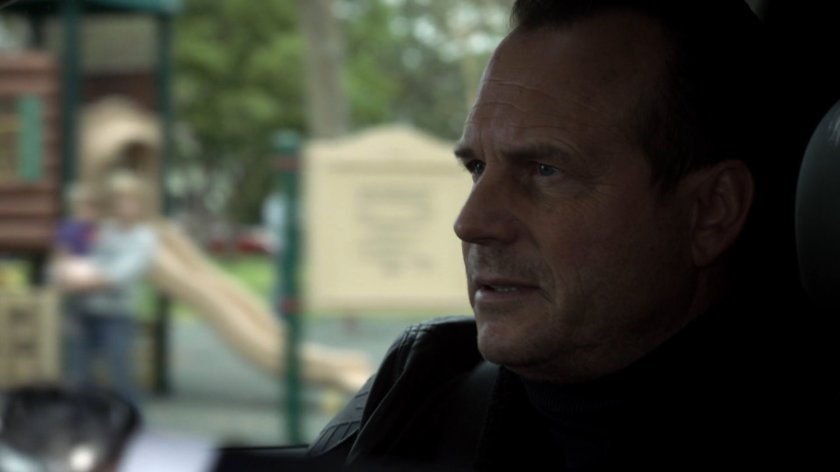 Garrett in a vehicle passing a playground.