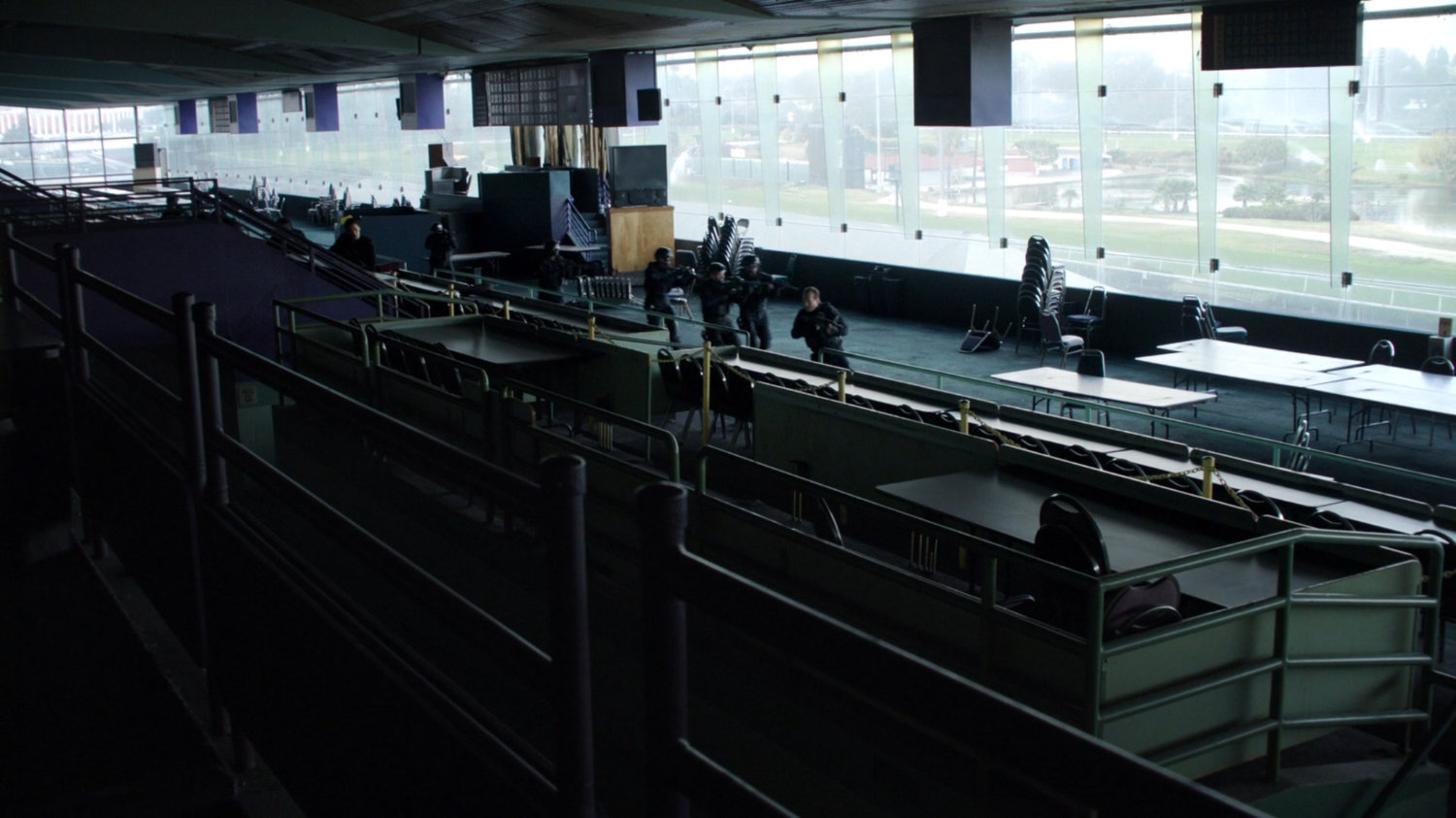 SHIELD agents inside the viewing box of an old racetrack.