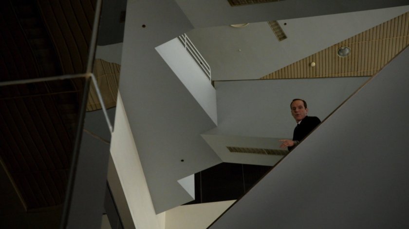 Coulson looking over a stairwell in an abandoned racetrack.