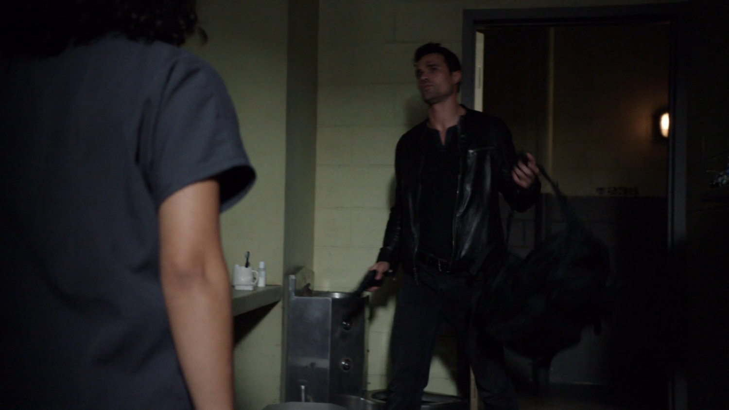 Ward entering Raina's prison cell.