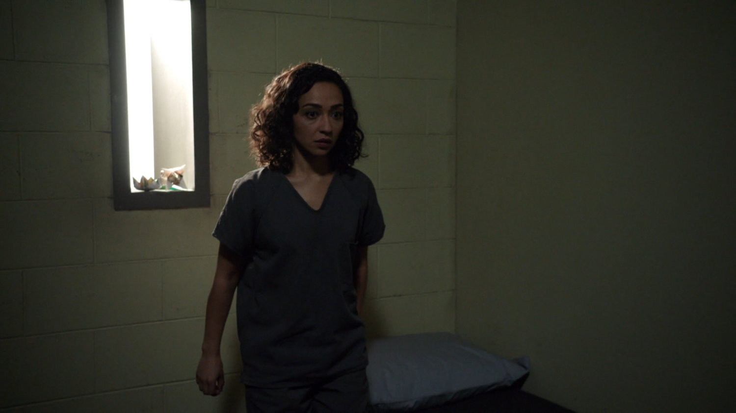 Raina in her prison cell.