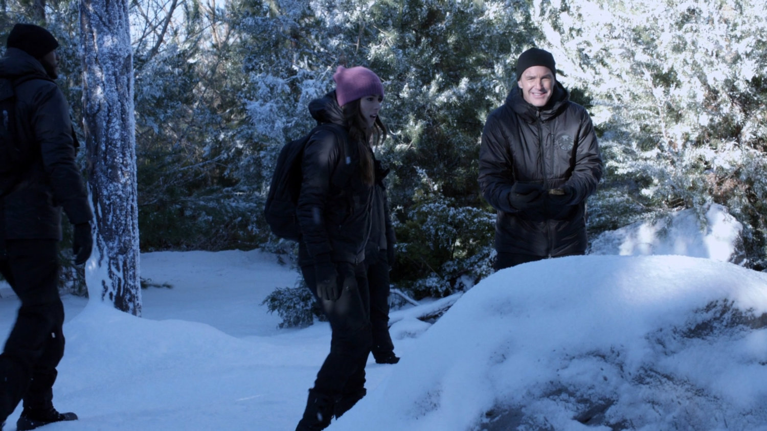 Skye and Coulson in snowy woods.