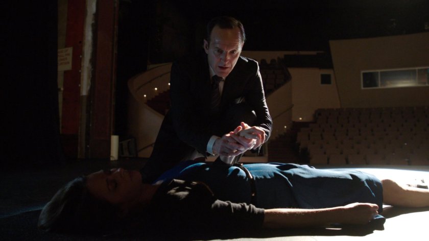 Audrey Nathan passed out on Portland theater stage, with Coulson holding her hand.