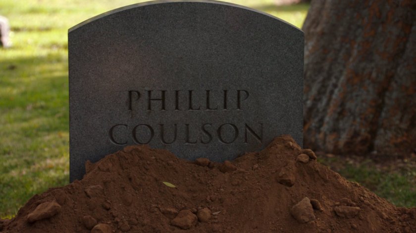 Closeup of grave headstone. Text: Phillip Coulson.