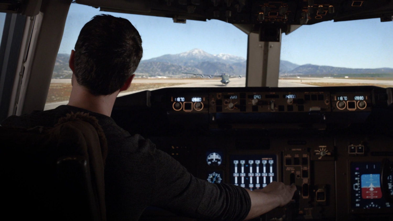 POV of Ward inside The Bus looking at a runway.