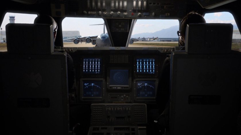 POV from inside smaller plane looking at The Bus.