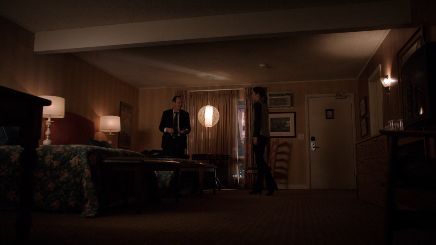 Coulson and Skye inside motel room.