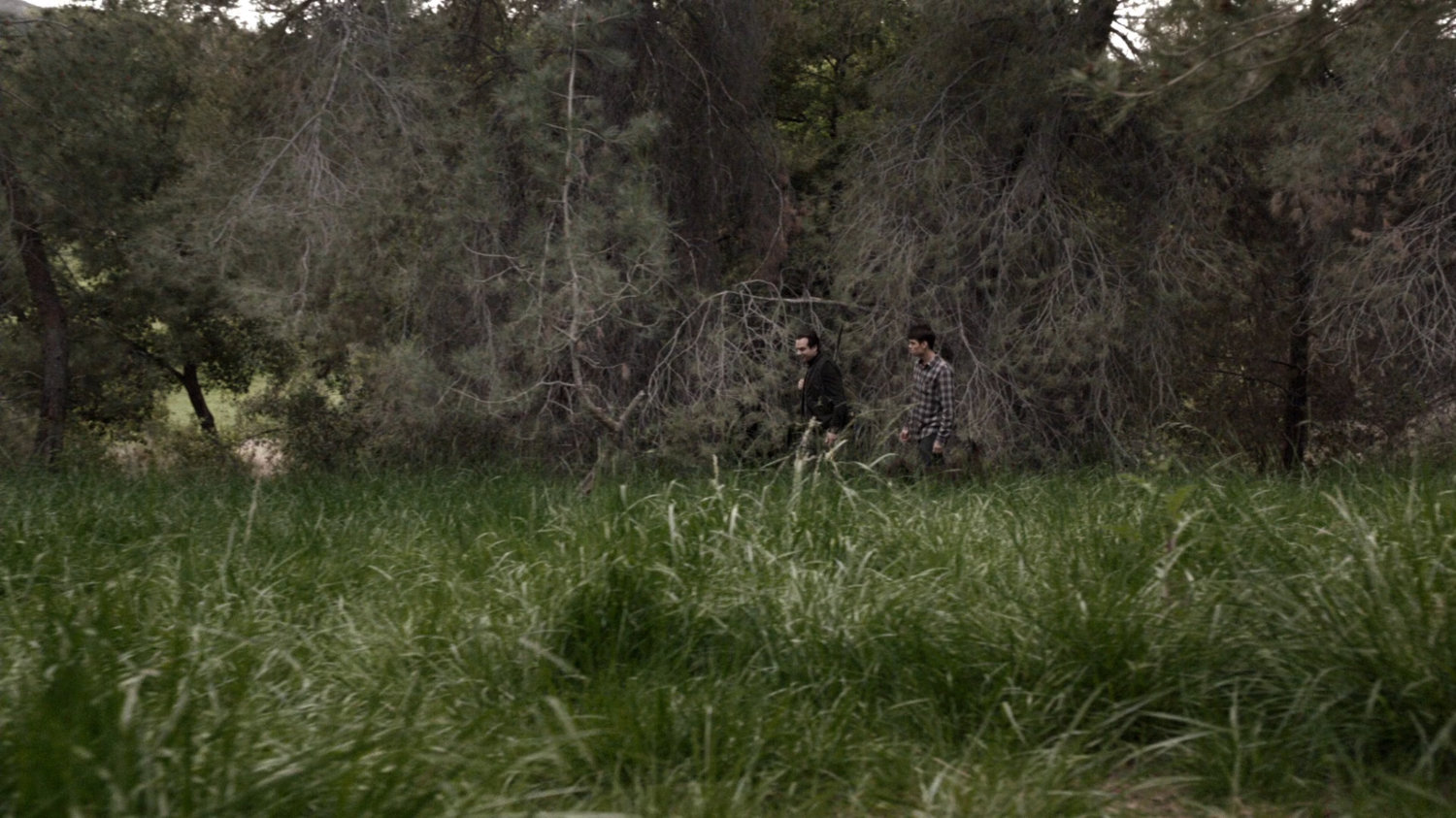 John Garrett and young Grant Ward in the woods of Wyoming.