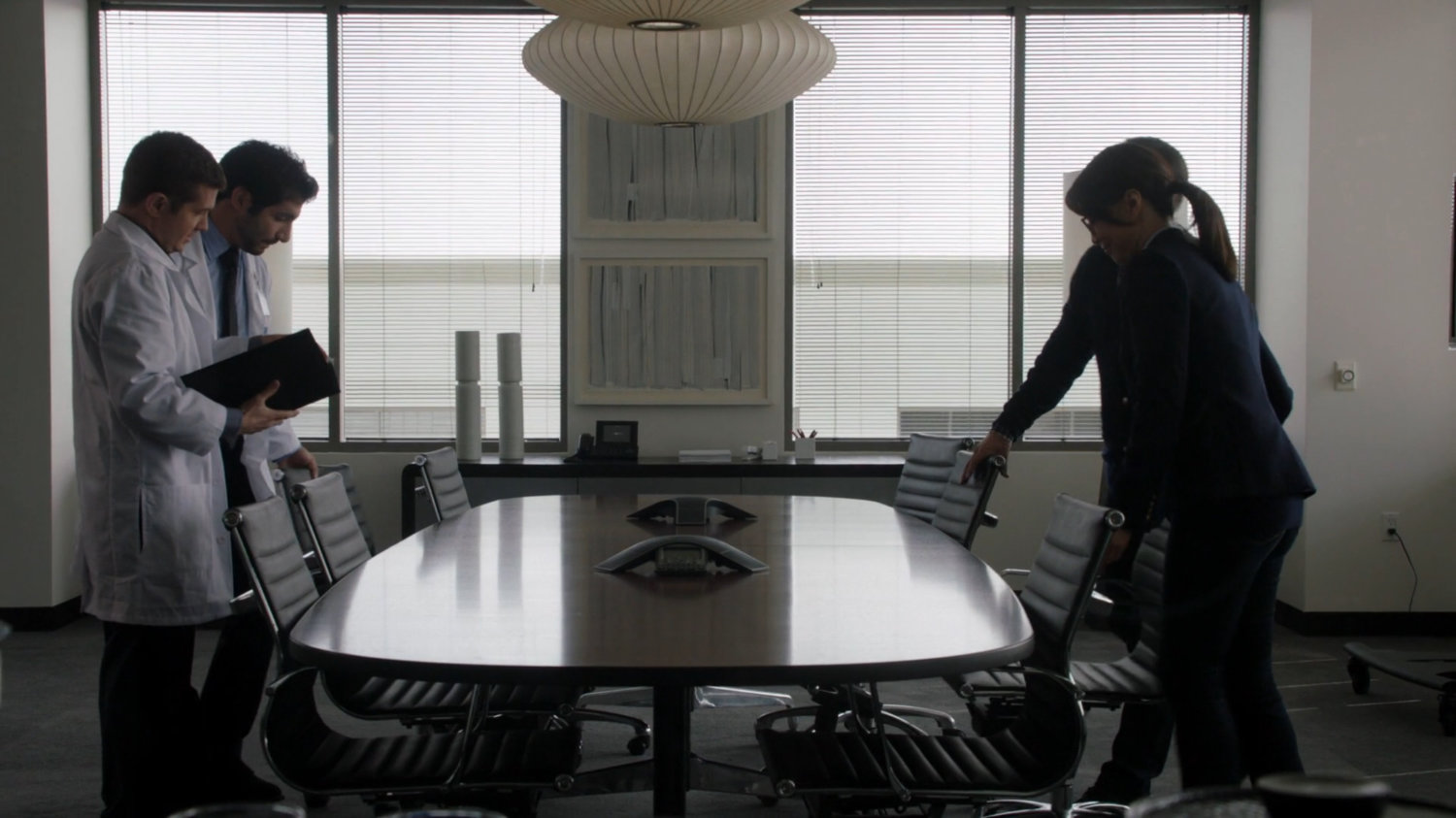 Interior of meeting room with Cybertek employees and Coulson and May.