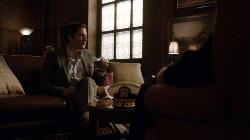 Ian Quinn in an officer's club.