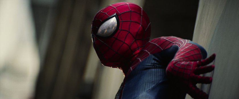 Spider-Man clinging to a wall.