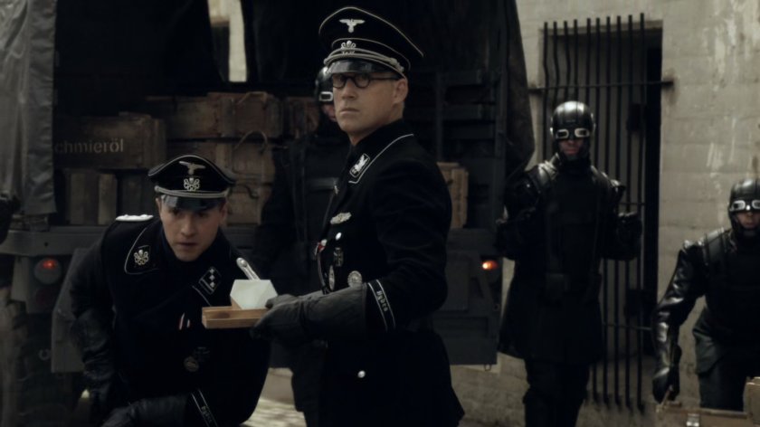 Doctor Werner Reinhardt and some HYDRA soldiers in a bunker.