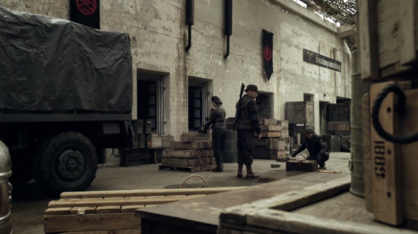 Howling Commandos cleanup crates in a HYDRA research facility during World War 2.