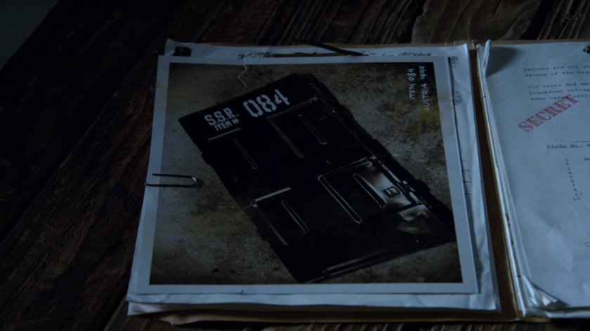 Close up of photo of old box labeled 084.