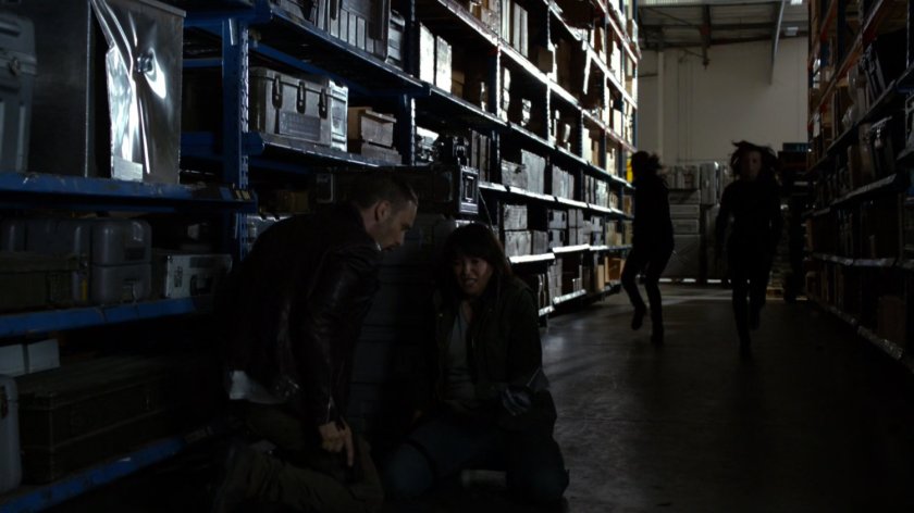 Agents in Marine Base warehouse aisle.