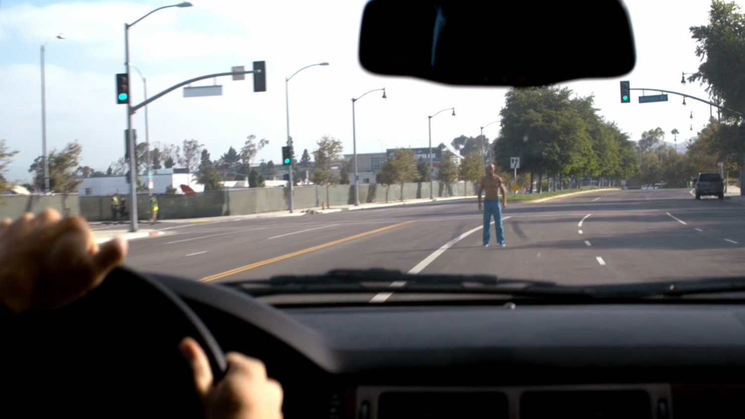 POV of Carl Creel standing in front of oncoming car.