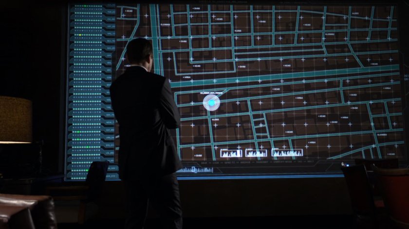 Coulson looking at a map of Agent May's pursuit.