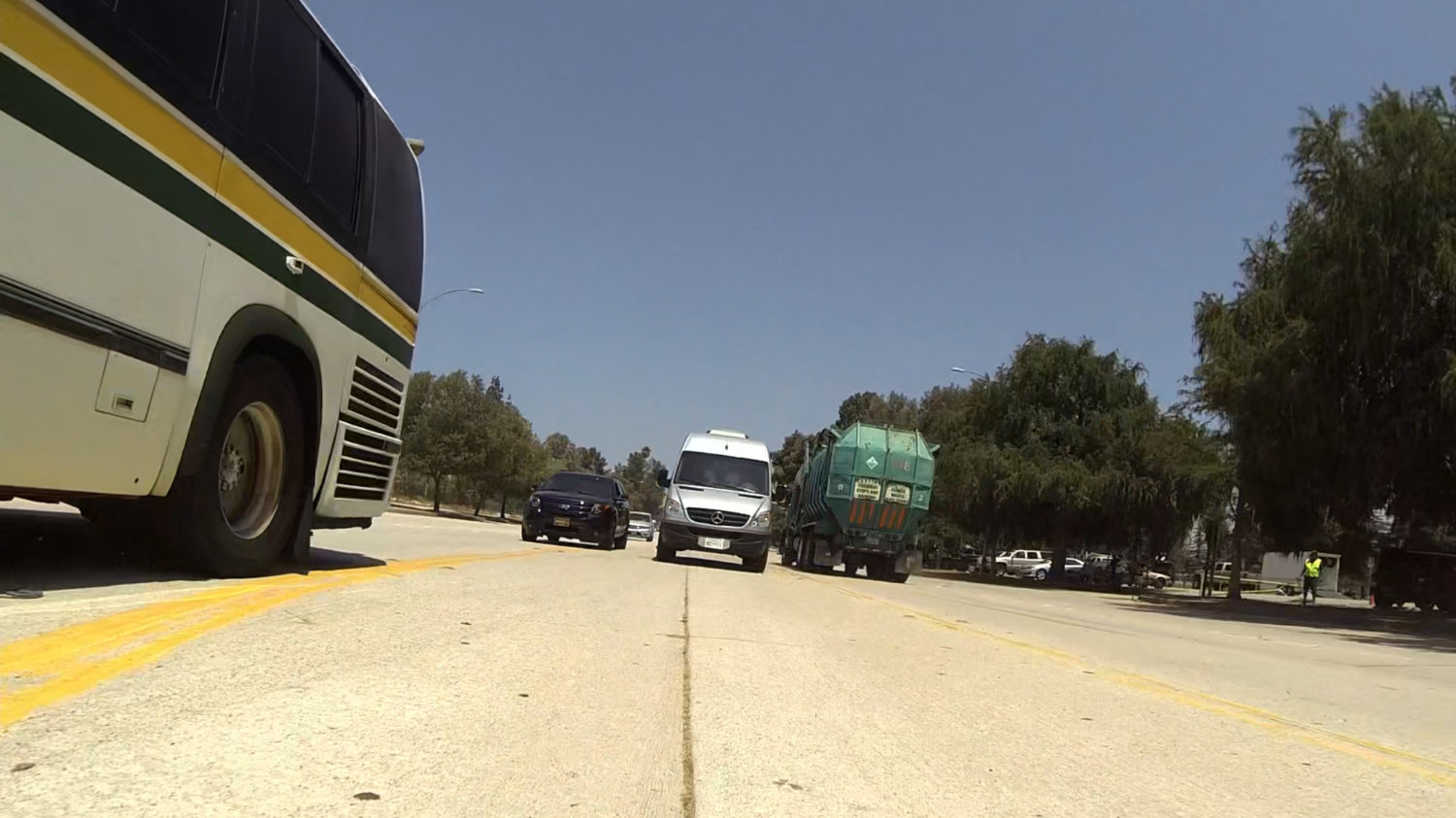 View of vehicles on city road.