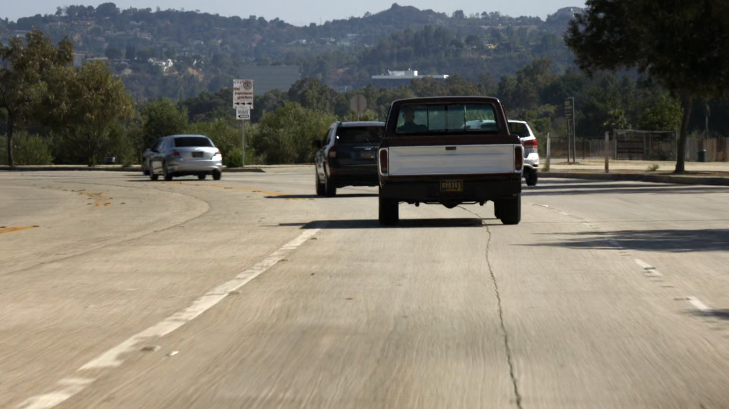 A pickup truck on a busy road.