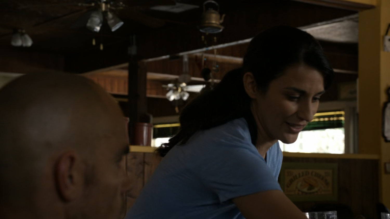 Waitress serving Creel in small roadside diner.