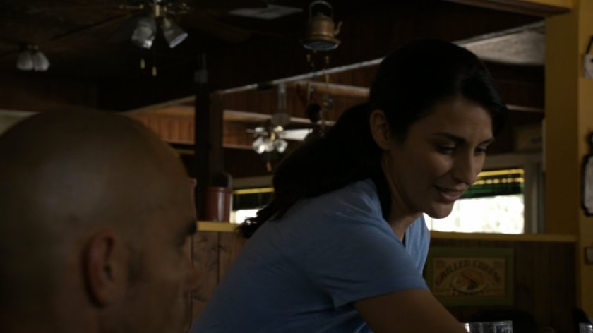 Waitress serving Creel in small roadside diner.