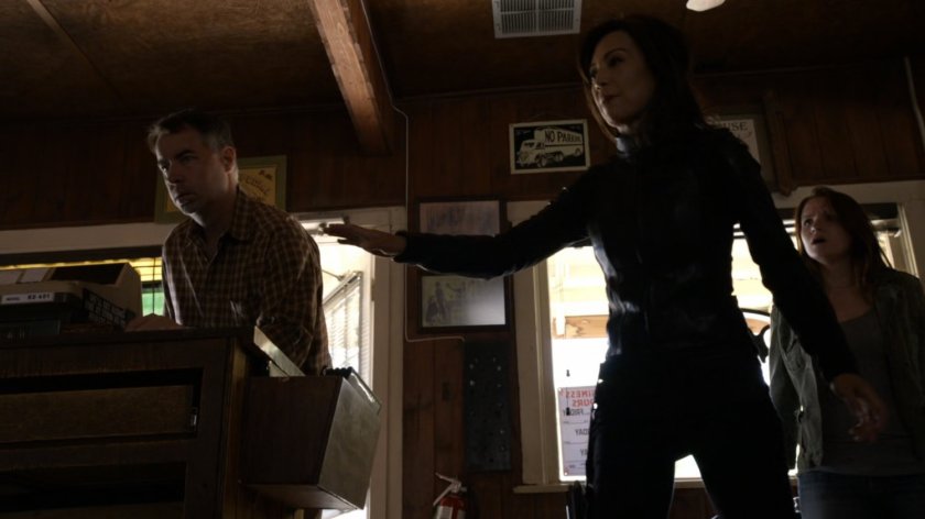 Agent May inside small roadside diner.