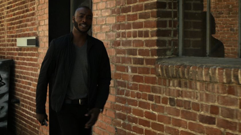Triplett in brick alley outside The Playground.