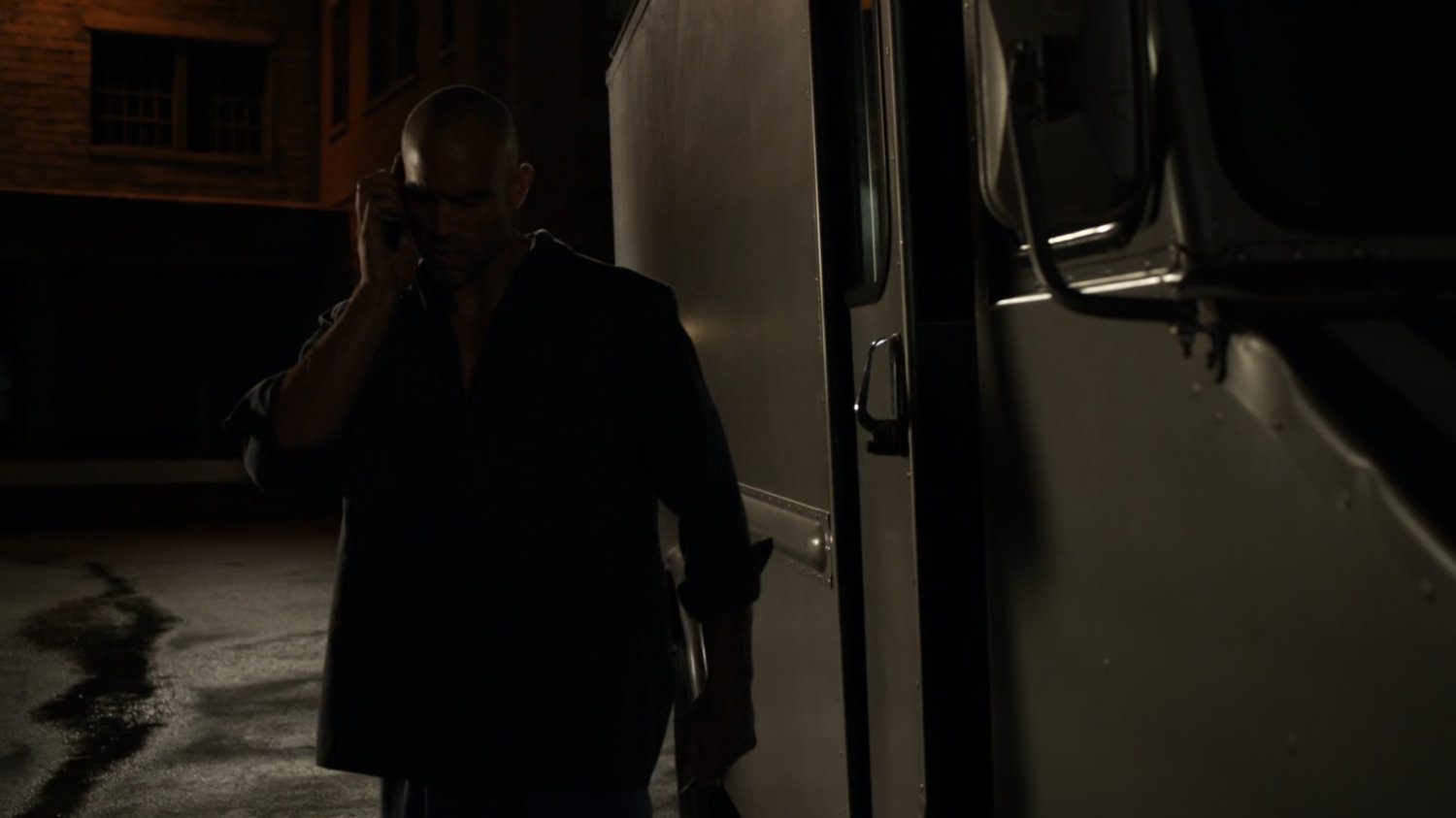 Carl Creel outside his van parked in a dark alley.