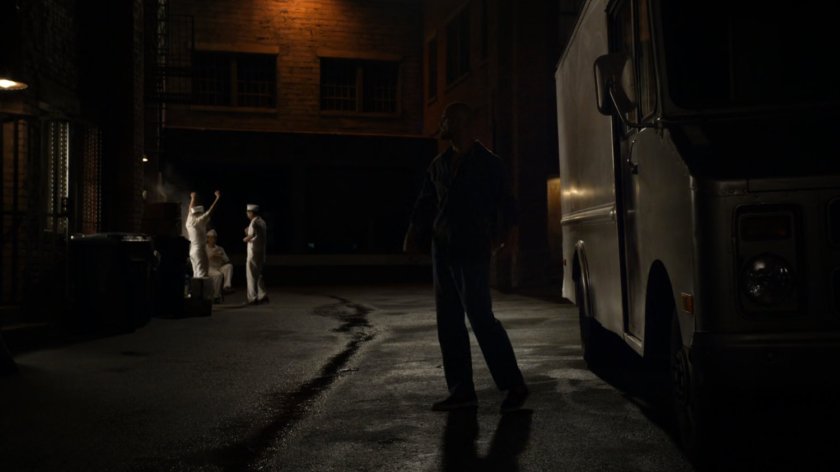 Carl Creel outside his van parked in a dark alley.
