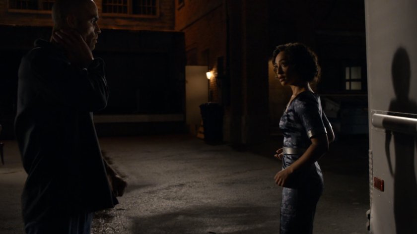 Carl Creel outside his van with Raina in a dark alley.