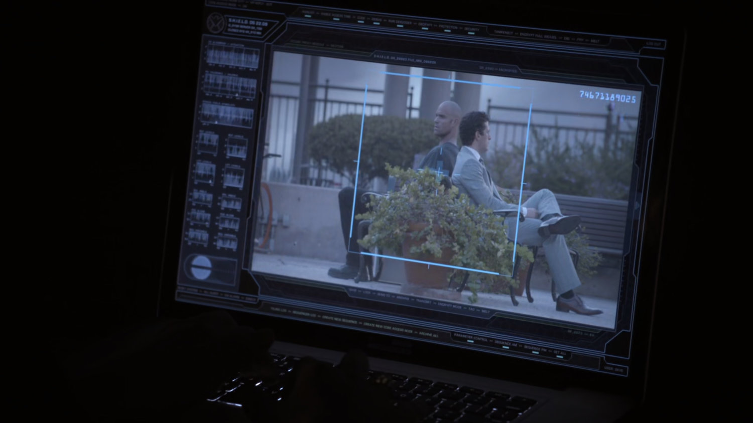 Video of Creel and Bakshi sitting in city park, on computer screen.