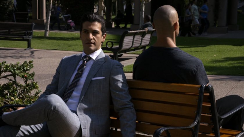 Creel talking with Bakshi in a city park.