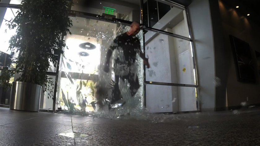 Creel busting through hotel window.